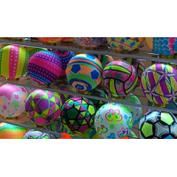 Colourful, patterned inflatable beach balls
