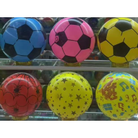 Colourful, patterned inflatable beach balls.